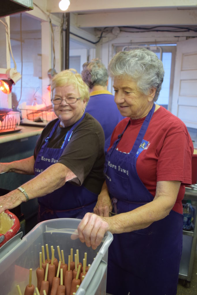 ladies cooking corndogs